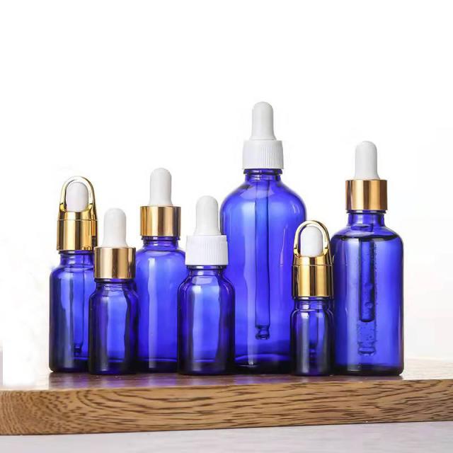 Blue essential oil glass bottle